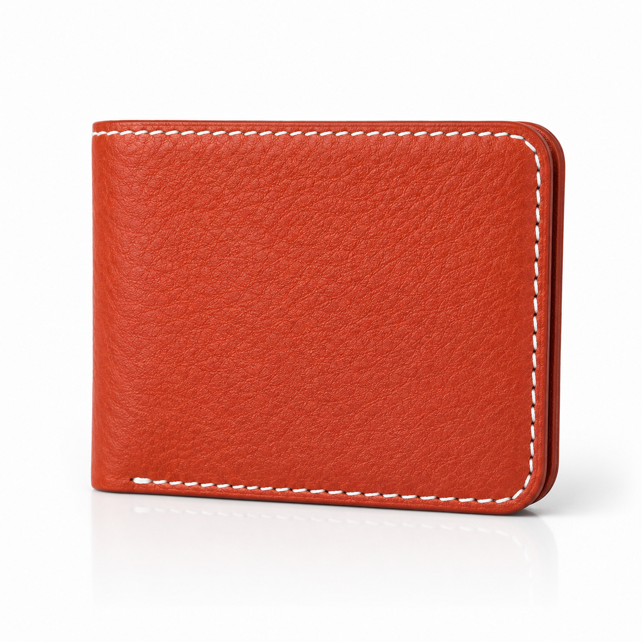 A red textured leather bifold wallet with white contrast stitching, shown closed on a clean white background with a soft reflection underneath.